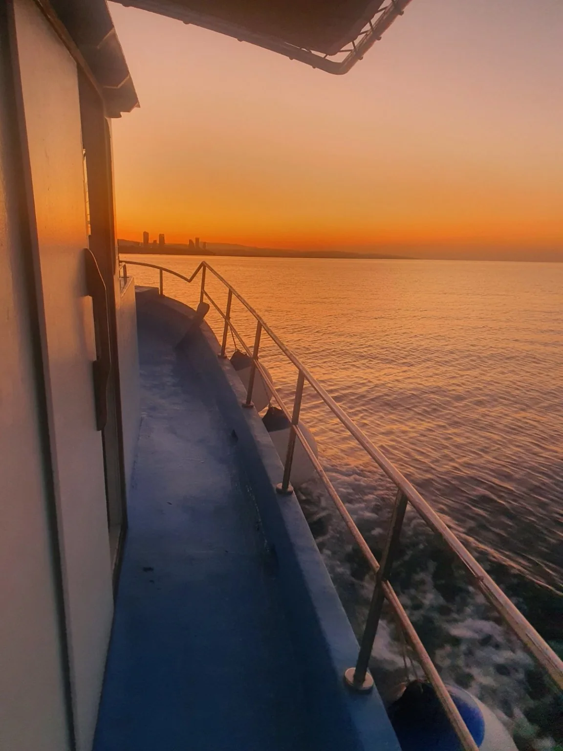 Golden sunset viewed from the deck of Theoni